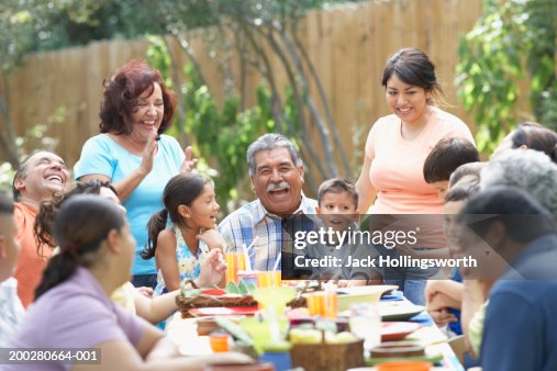 Three generation family sitting at a picnic table Three generation family sitting at a picnic table