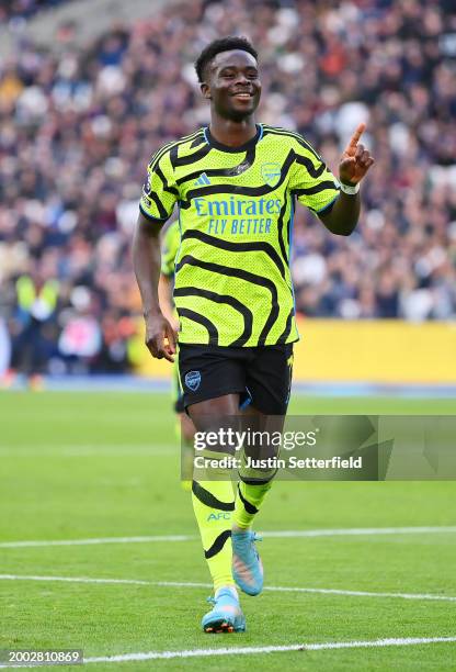 Bukayo Saka of Arsenal celebrates scoring his team's fifth goal during the Premier League match between West Ham United and Arsenal FC at London...