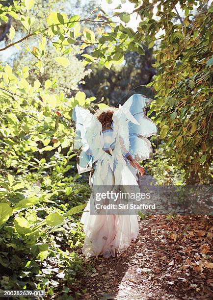 girl (3-5) wearing costume with wings, rear view - fairy costume stock pictures, royalty-free photos & images