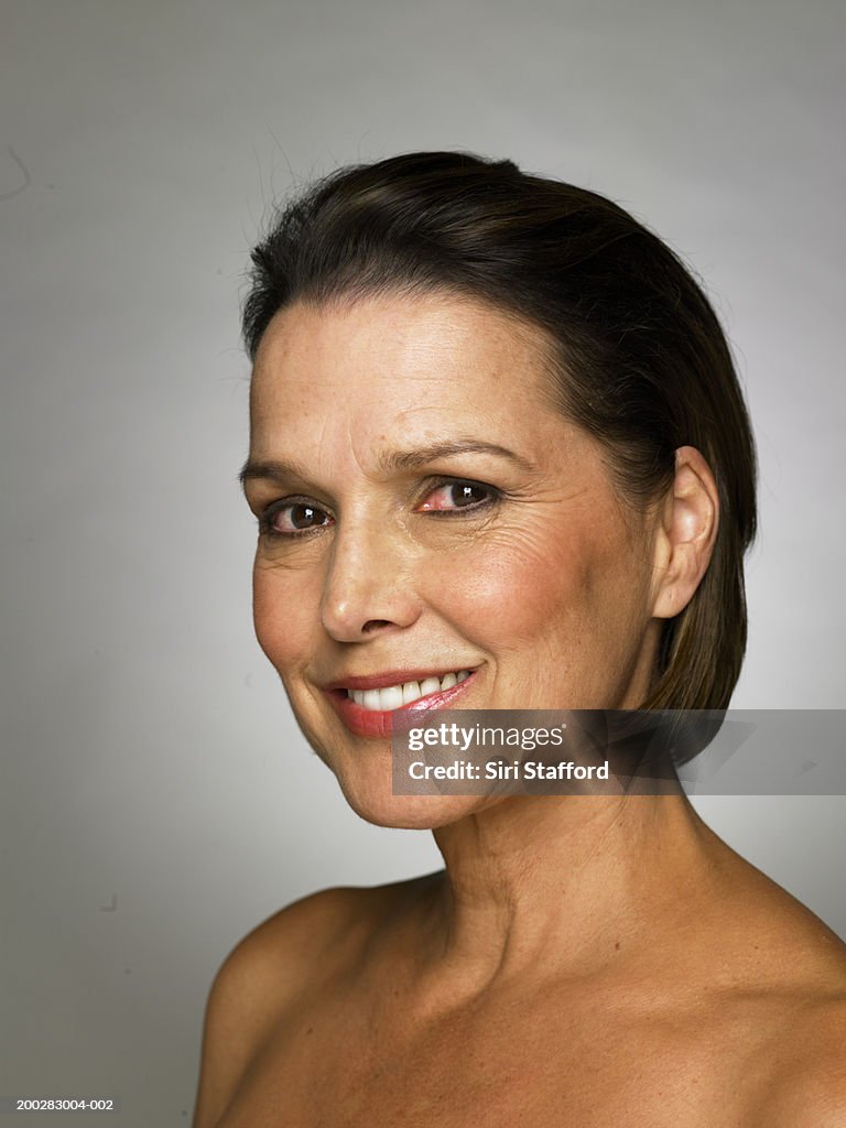 Mature woman smiling, portrait