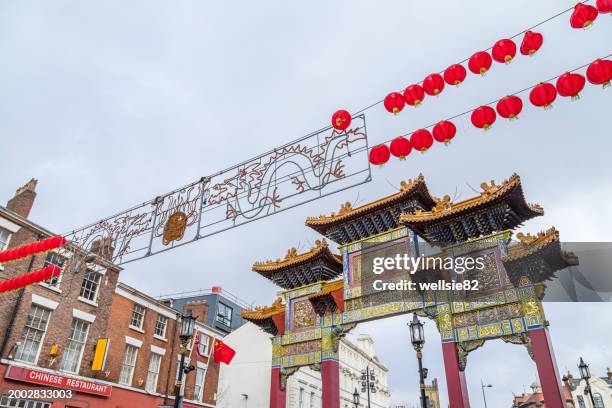 paifang in chinatown at new year - liverpool celebrating stock pictures, royalty-free photos & images