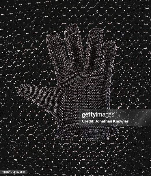 oyster glove on chainmail, close-up (digital composite) - chain mail stock pictures, royalty-free photos & images