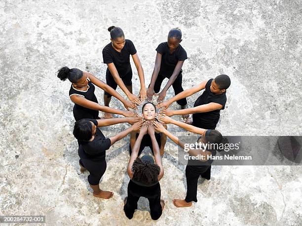 dancers (13-20) forming circle, elevated view - surrounding support stock pictures, royalty-free photos & images