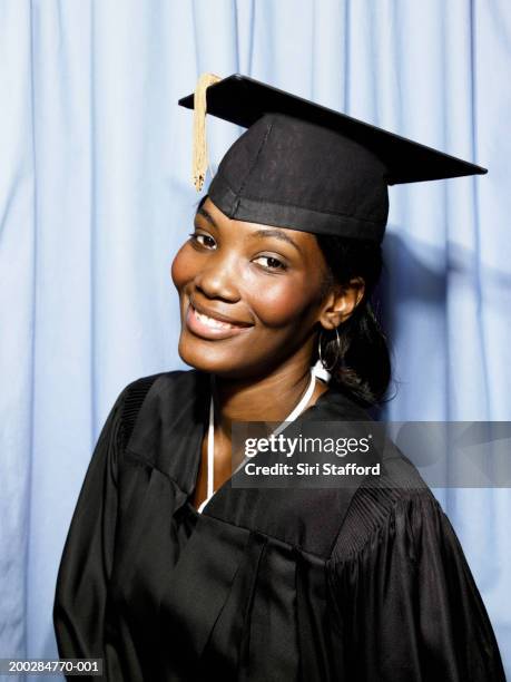 female graduate in photo booth - black gown stock pictures, royalty-free photos & images