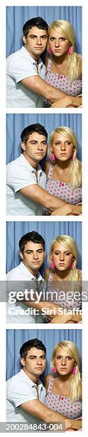 young couple in photo booth, portrait - photo booth couple stock pictures, royalty-free photos & images