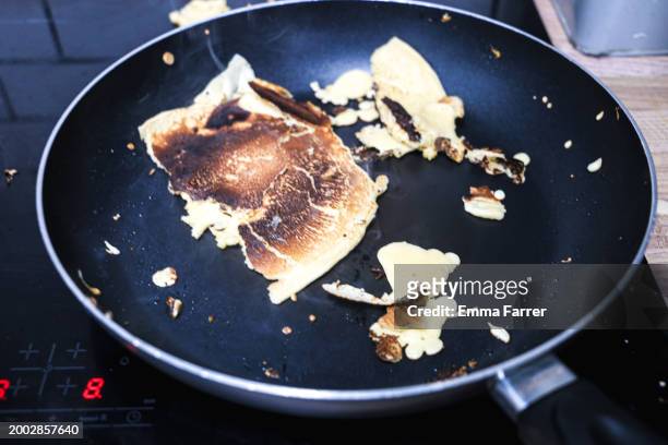 pancake disasters - baking pan stock pictures, royalty-free photos & images