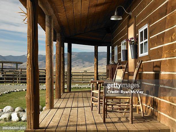 usa, montana, bozeman, chairs on porch of cabin - bozeman stock pictures, royalty-free photos & images