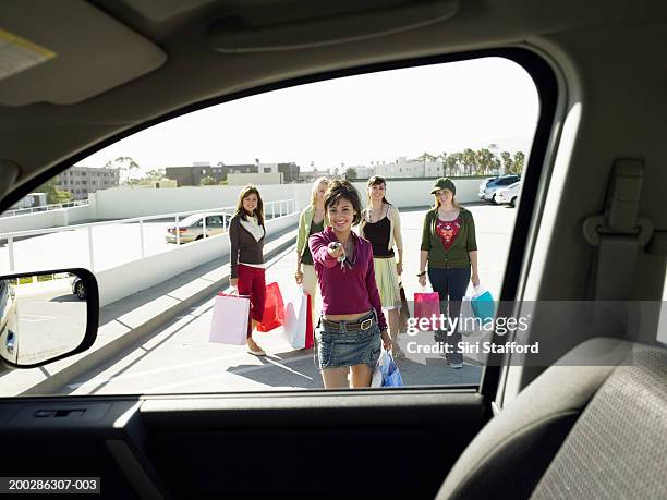 teenage girls (17-19) walking to car,  one holding door remote - southern california open day five bildbanksfoton och bilder