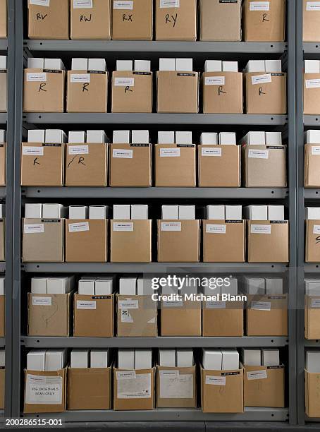 rows of boxes in storage room - archive 2005 stock pictures, royalty-free photos & images