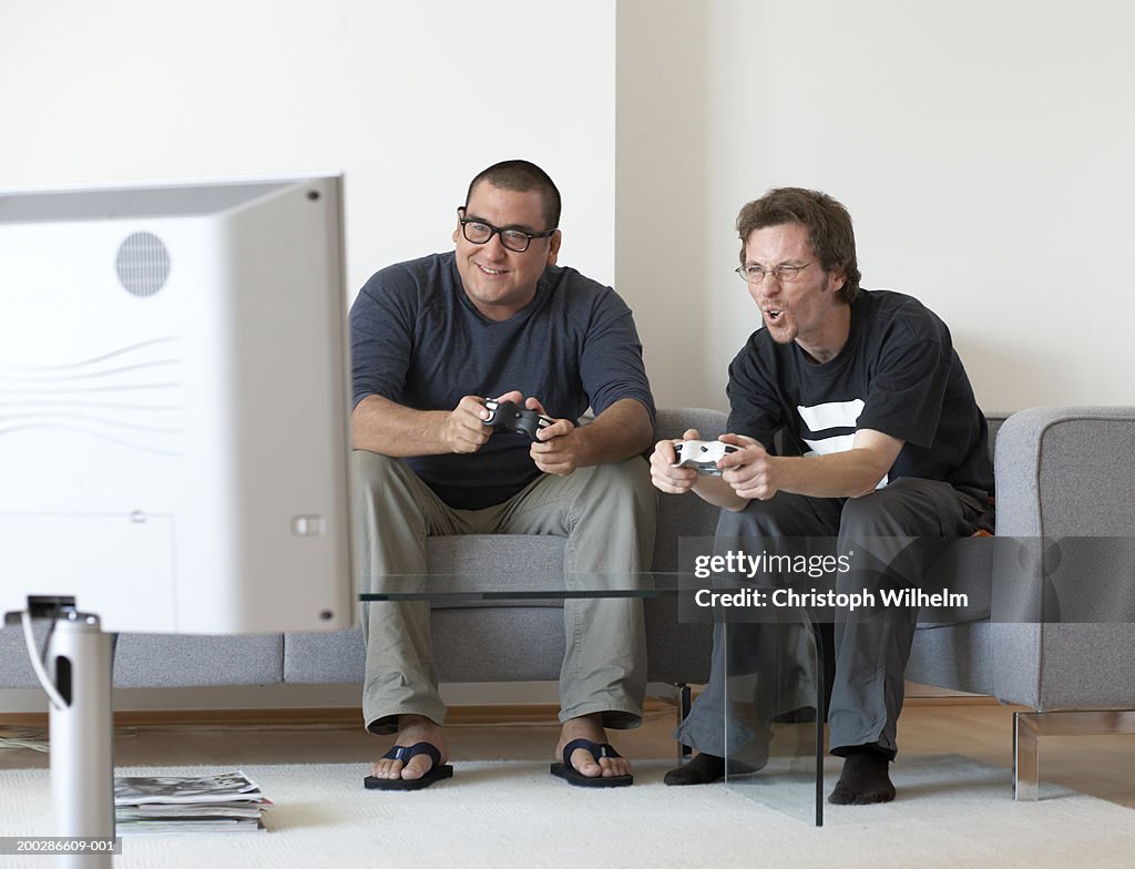 Two men playing video game