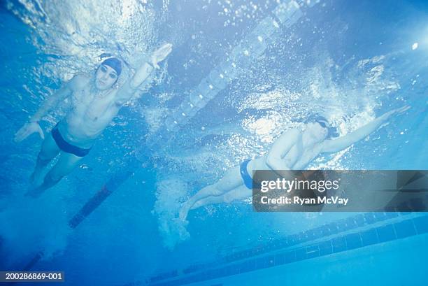 men racing in swimming pool, underwater view - aerobics stock pictures, royalty-free photos & images
