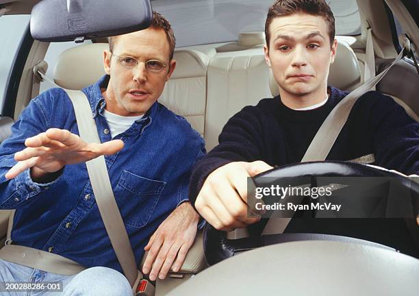 father teaching son to drive car - front passenger seat stock pictures, royalty-free photos & images