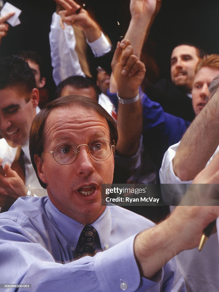 Brokers working during stock exchange session, elevated view