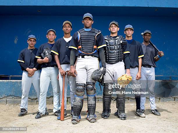baseball players in dugout, portrait - baseball glove stock-fotos und bilder