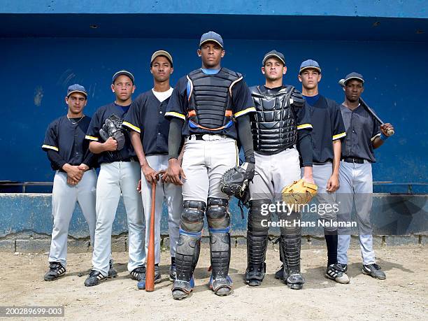 baseball players in dugout, portrait - amateur baseball stock pictures, royalty-free photos & images