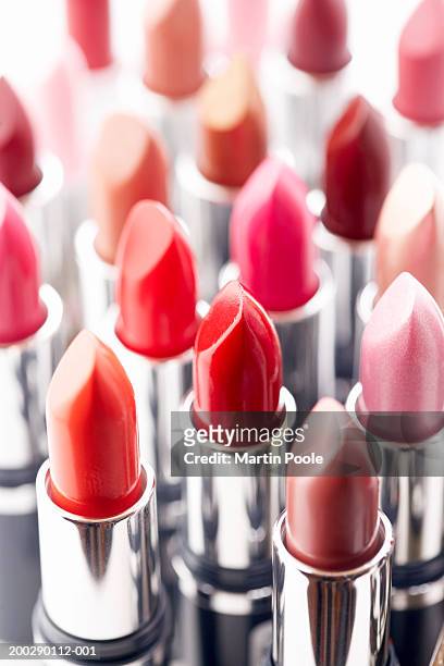 assortment of coloured lipsticks, close-up - rossetto foto e immagini stock
