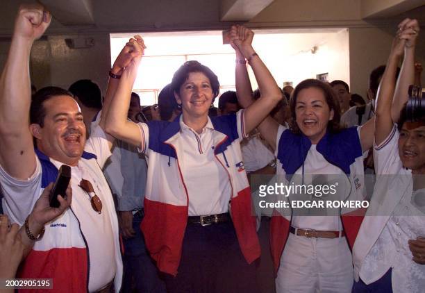 Candidate Evelyn Jacir de Lobo is seen with supporters at the voting center in San Salvador, El Salvador 16 March 2003. La candidata a la alcaldía de...