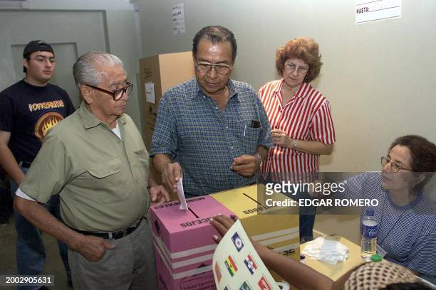 Elderly voters are seen placing their ballots in the box in San Salvador, El Salvador 16 March 2003. Ciudadanos de la tercera edad votan el 16 de...