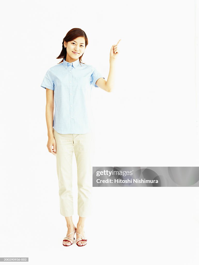 Young woman standing, portrait