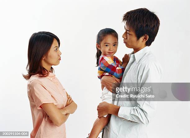 parents with daughter, father carrying girl (2-3) - couple relationship difficulties stock pictures, royalty-free photos & images