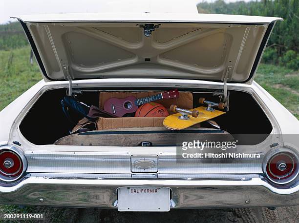 car trunk packed with vacation gear - car trunk fotografías e imágenes de stock
