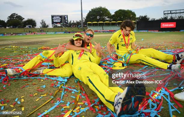 Charlie Anderson of Australia celebrates with Sam Konstas and Tom Straker after defeating India during the ICC U19 Men's Cricket World Cup South...