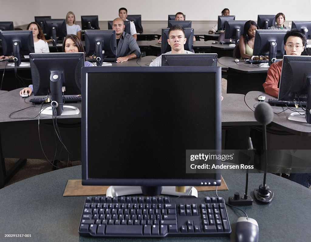 Single College Student Using Computer Group Of College Students Using Computers In Classroom High-Res Stock ...