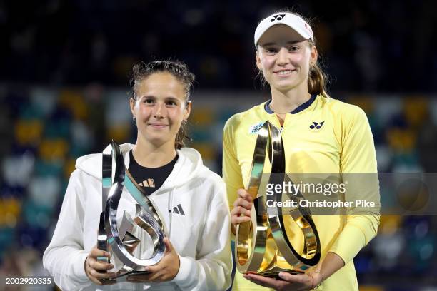 Daria Kasatkina and Elena Rybakina of Kazakhstan pose with their trophies after the final match on day 7 of the Mubadala Abu Dhabi Open, part of the...