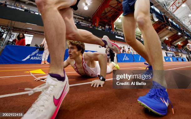 The team from Upper Dublin-PA fumble the baton on the exchange in the Boys' 4x800 race during the 116th Millrose Games at The Armory Track on...