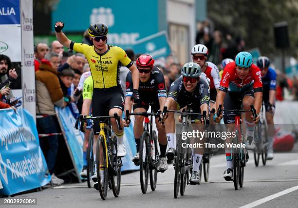 Olav Kooij of The Netherlands and Team Visma | Lease a Bike celebrates at finish line as race winner ahead of Matteo Trentin of Italy and Tudor Pro...