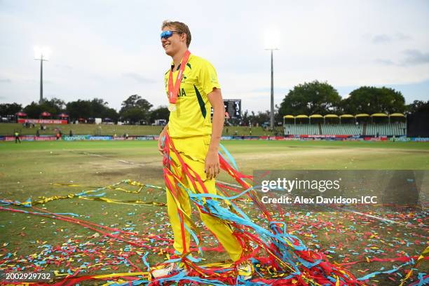 Charlie Anderson of Australia looks on as he walks through a pile of confetti as he celebrates after Australia defeat India during the ICC U19 Men's...