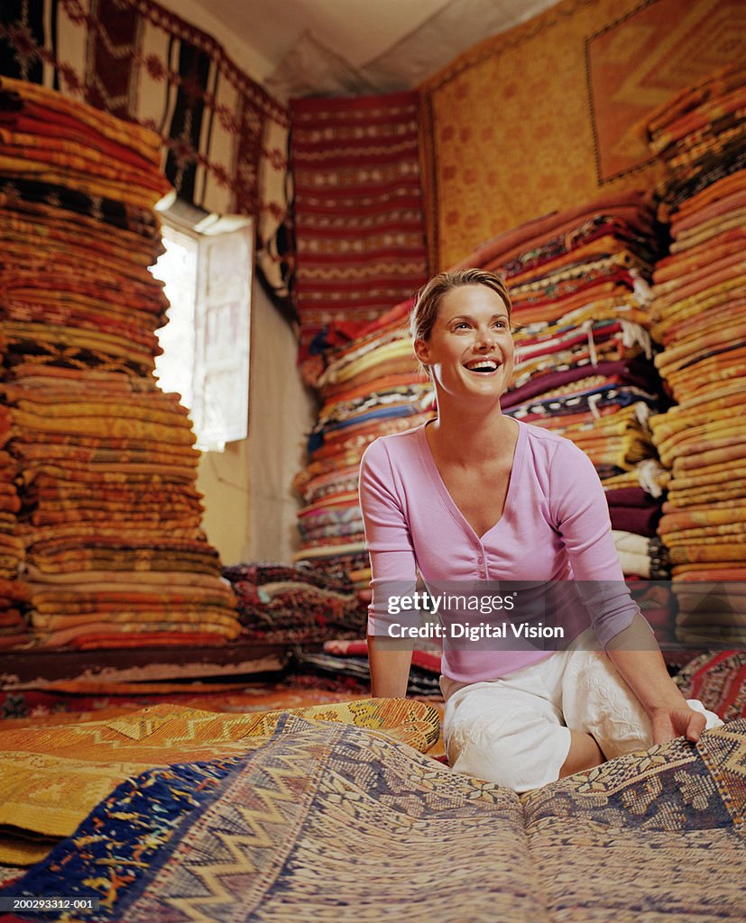 Lady On Rug Woman Looking At Rug In Rug Shop Smiling High-Res Stock Photo - Getty ...