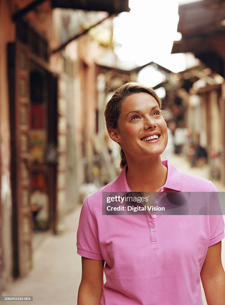 Young woman outdoors, smiling