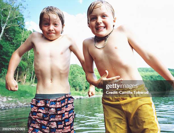 Two Boys Playing In Lake Summer High-Res Stock Photo - Getty Images