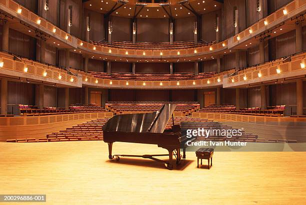piano on stage in empty theater - stage performance space stock pictures, royalty-free photos & images