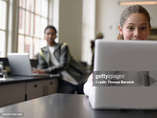 Two Girls Children Using Computer In The Classroom Photos and Premium ...