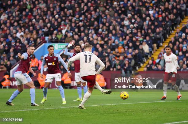 Rasmus Hojlund of Manchester United scores his team's first goal during the Premier League match between Aston Villa and Manchester United at Villa...