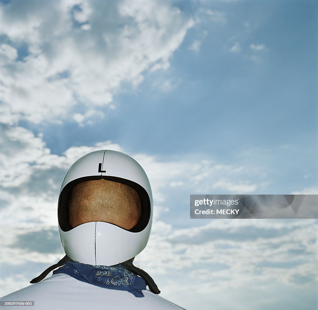 Man wearing helmet back to front, rear view, close-up