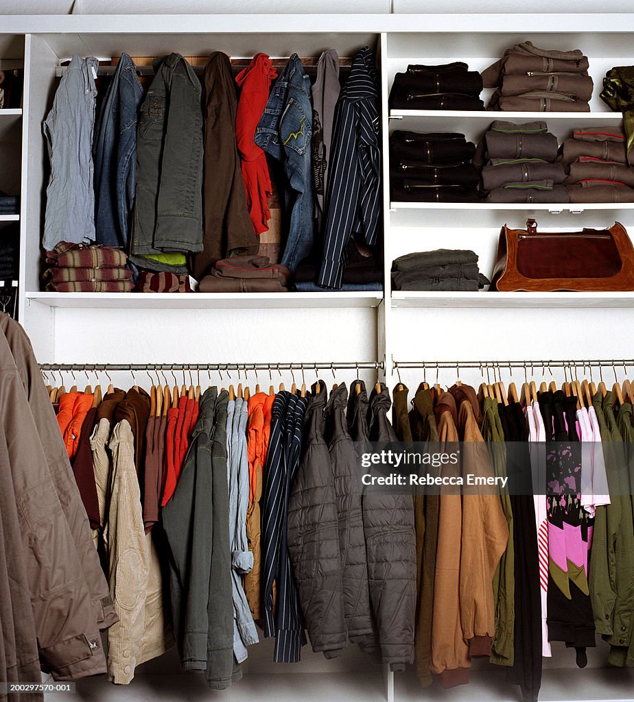 Clothing on racks and shelves in store