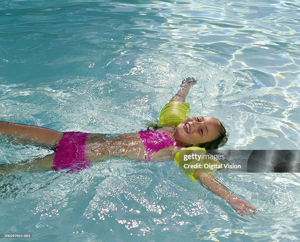 Tween Floating Inpool Girl Floating In Pool Outdoors Portrait High-Res Stock Photo - Getty Images