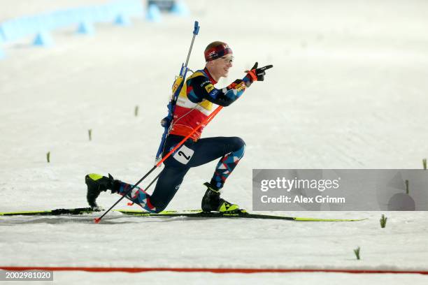 Johannes Thingnes Boe of Norway celebrates as he approaches the finish line to win the Men's 12.5k Pursuit at the IBU World Championships Biathlon...