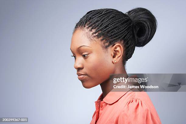 teenage girl (15-17) with hair tied back, close-up, profile - female profile stock pictures, royalty-free photos & images