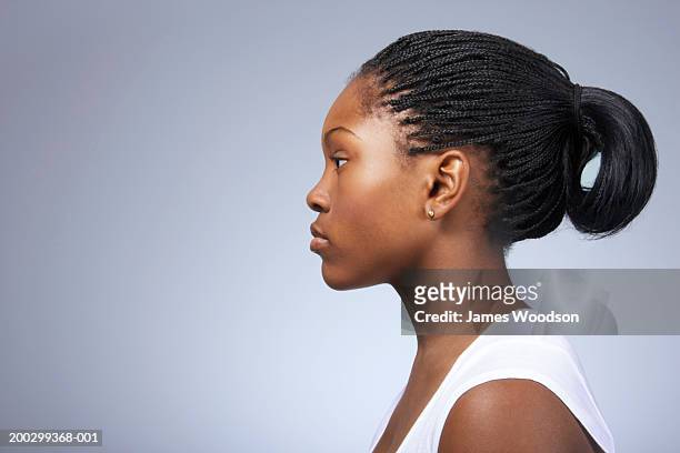 teenage girl (15-17) with hair tied back, close-up, profile - braided hairstyles for african american girls stock pictures, royalty-free photos & images