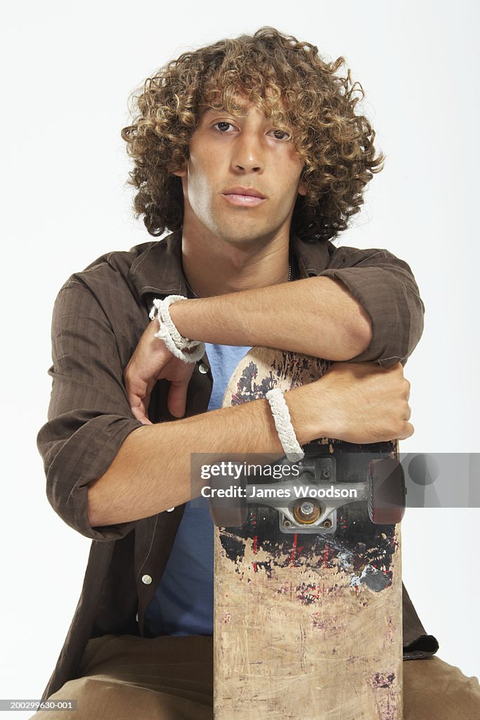 Teenage Boy With Curly Hair Leaning On Skateboard Portrait High-Res Stock Photo - Getty Images Teenage Boy With Curly Hair Leaning On Skateboard Portrait High-Res Stock Photo - Getty Images