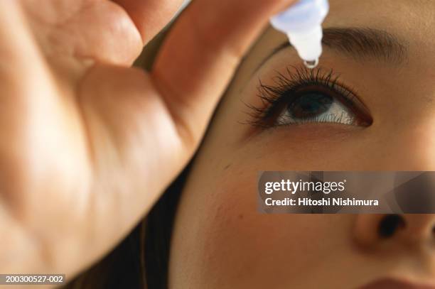 woman using eye drops, close-up - augentropfen stock-fotos und bilder