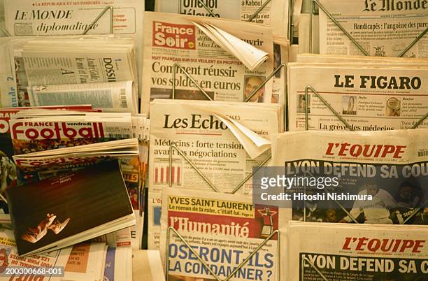 newspaper in rack - news stand stock pictures, royalty-free photos & images