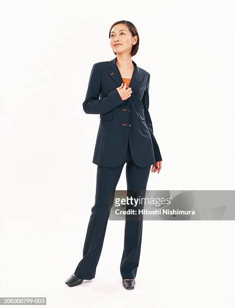 businesswoman looking away, smiling - female suit stockfoto's en -beelden