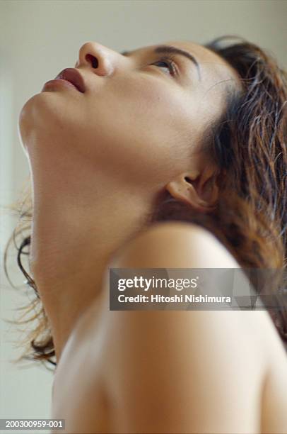 young woman looking up, low angle view - nudity stock pictures, royalty-free photos & images