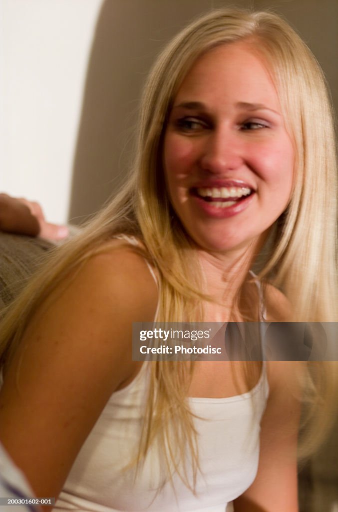 Young blonde girl smiling