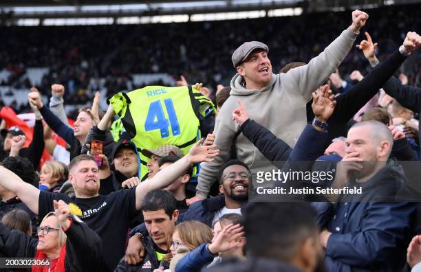 Arsenal fans celebrate after the goal of Declan Rice during the Premier League match between West Ham United and Arsenal FC at London Stadium on...
